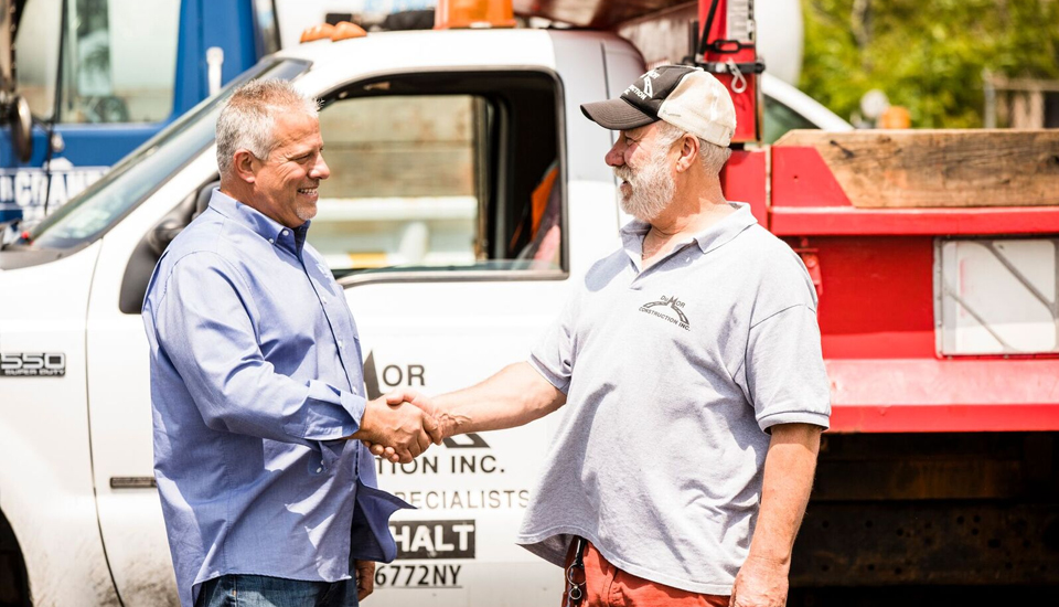 used-truck-sales-dave-with-happy-customer