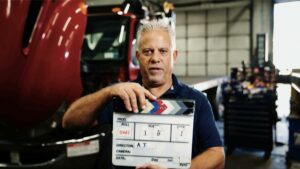 A picture of Dave holding an actor's clapboard